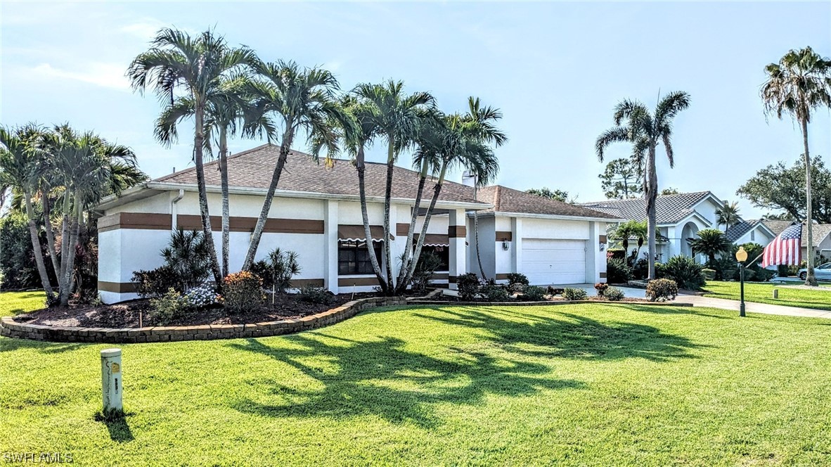 a view of a house with swimming pool and sitting area