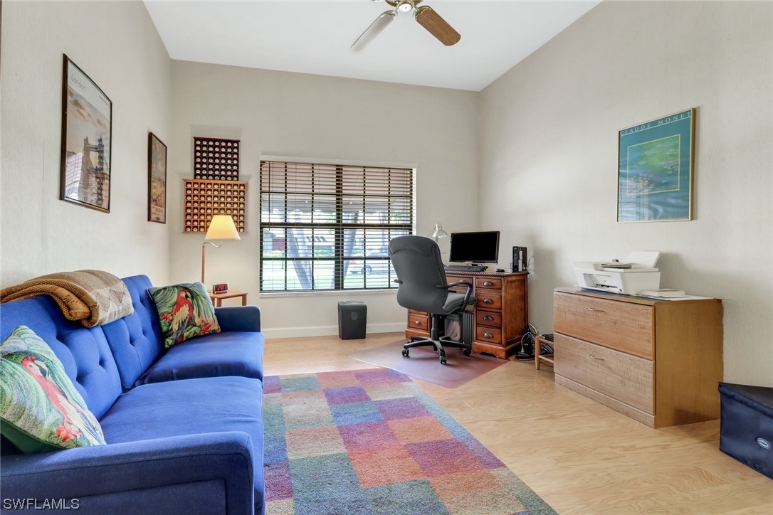 14813 Soaring Eagle Court Fort Myers, FL 33912 - Photo 11 of 19 a view of a livingroom with workspace and a couch