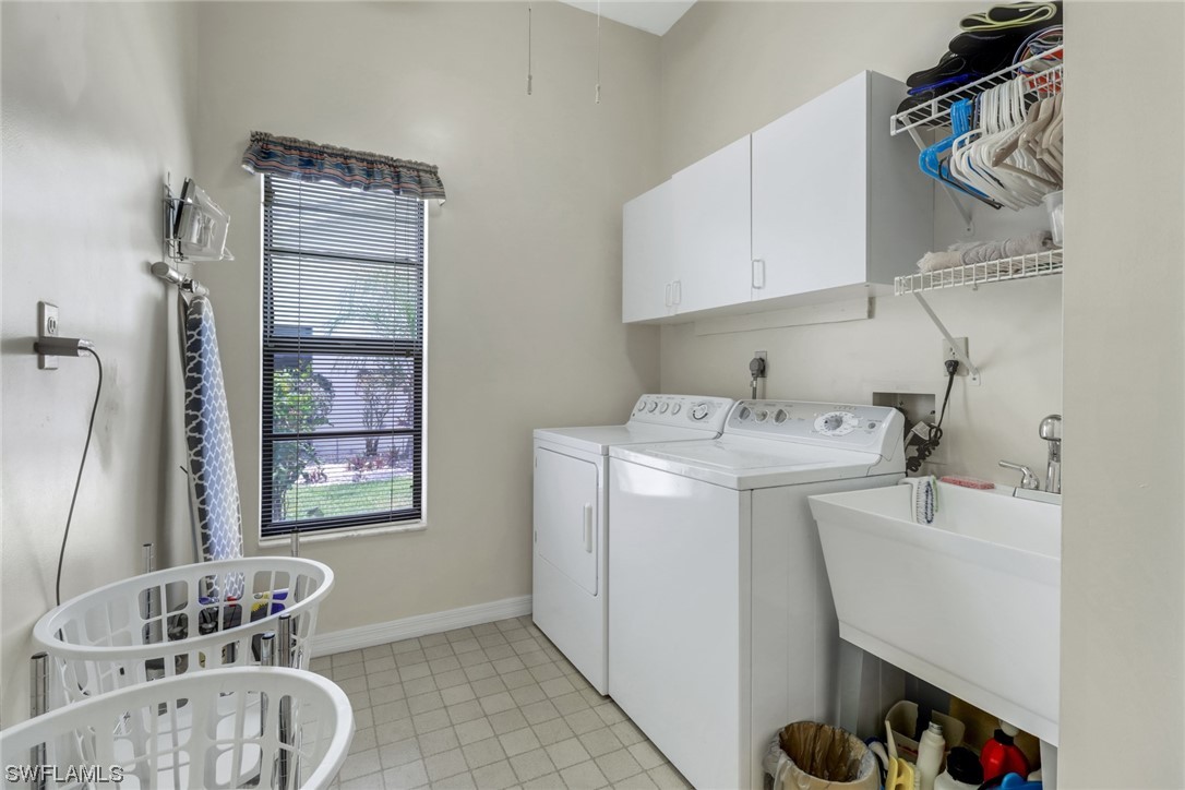 14813 Soaring Eagle Court Fort Myers, FL 33912 - Photo 14 of 19 a utility room with dryer and washer