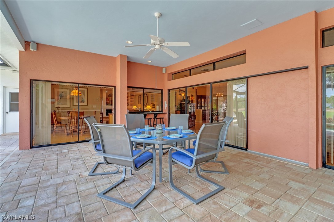 14813 Soaring Eagle Court Fort Myers, FL 33912 - Photo 16 of 19 a dining room with furniture a chandelier and window