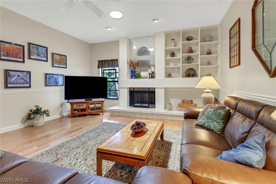14813 Soaring Eagle Court Fort Myers, FL 33912 - Photo 5 of 19 a living room with furniture and a flat screen tv