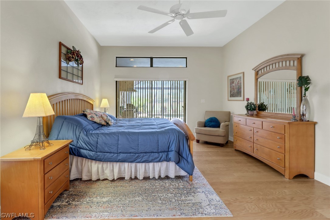 14813 Soaring Eagle Court Fort Myers, FL 33912 - Photo 8 of 19 a bedroom with a bed and window