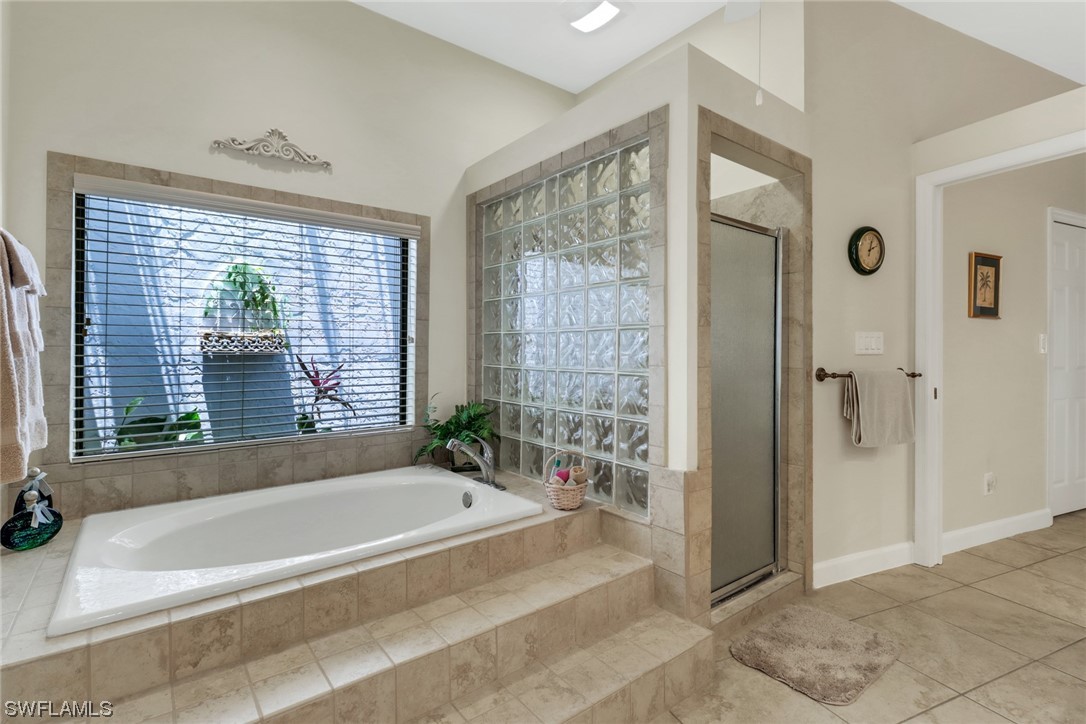 14813 Soaring Eagle Court Fort Myers, FL 33912 - Photo 10 of 19 a spacious bathroom with a bathtub and shower