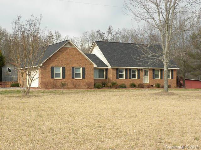 1813 Claude Austin Road Monroe, NC 28112 - Photo 1 of 22 front view of a house with a yard
