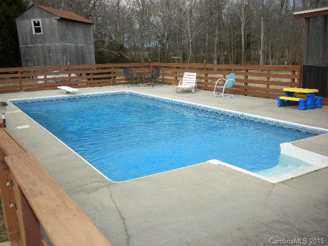 1813 Claude Austin Road Monroe, NC 28112 - Photo 13 of 22 a view of a swimming pool with a patio