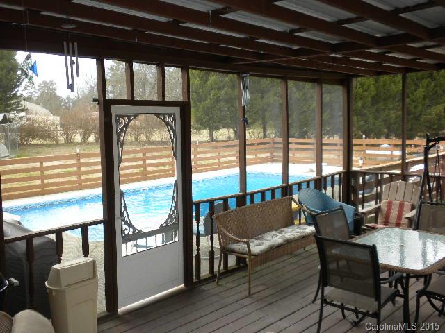 1813 Claude Austin Road Monroe, NC 28112 - Photo 17 of 22 a living room with furniture and a floor to ceiling window