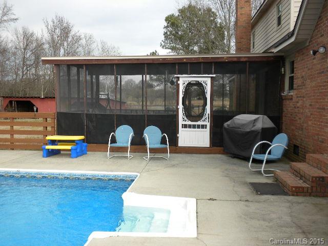 1813 Claude Austin Road Monroe, NC 28112 - Photo 18 of 22 a backyard of a house with barbeque oven and outdoor seating