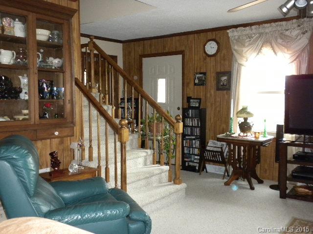 1813 Claude Austin Road Monroe, NC 28112 - Photo 4 of 22 a living room with furniture and a dining table with projector the view