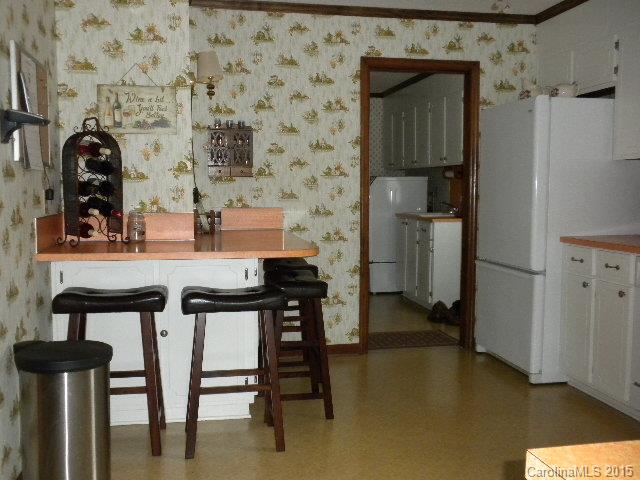 1813 Claude Austin Road Monroe, NC 28112 - Photo 7 of 22 a kitchen with a sink cabinets and appliances