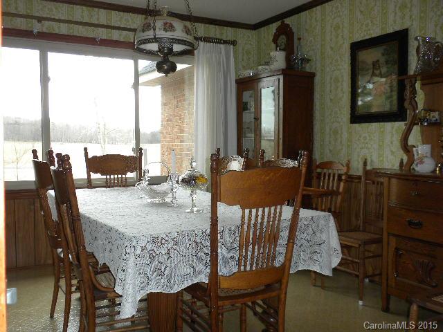 1813 Claude Austin Road Monroe, NC 28112 - Photo 9 of 22 a view of a dining room with furniture window and outside view