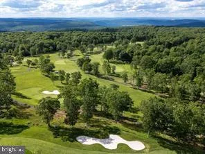 a view of a road with a building in the background