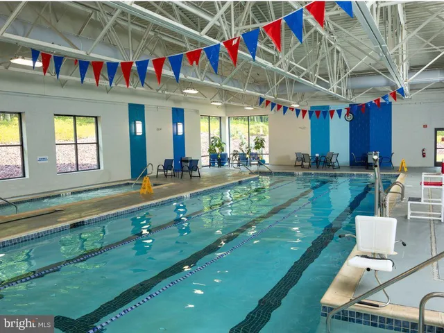 a view of swimming pool with a balcony