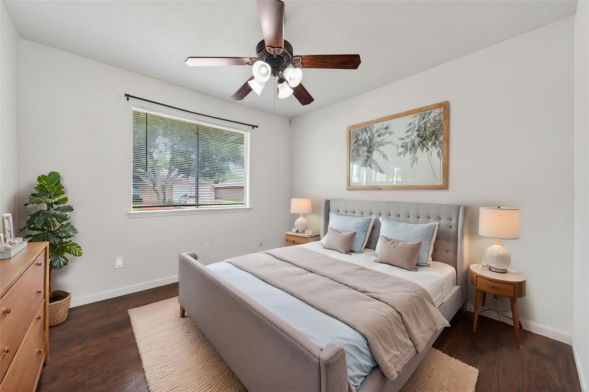 17002 Dew Drop Lane Houston, TX 77095 - Photo 13 of 24 a bedroom with bed and a chandelier