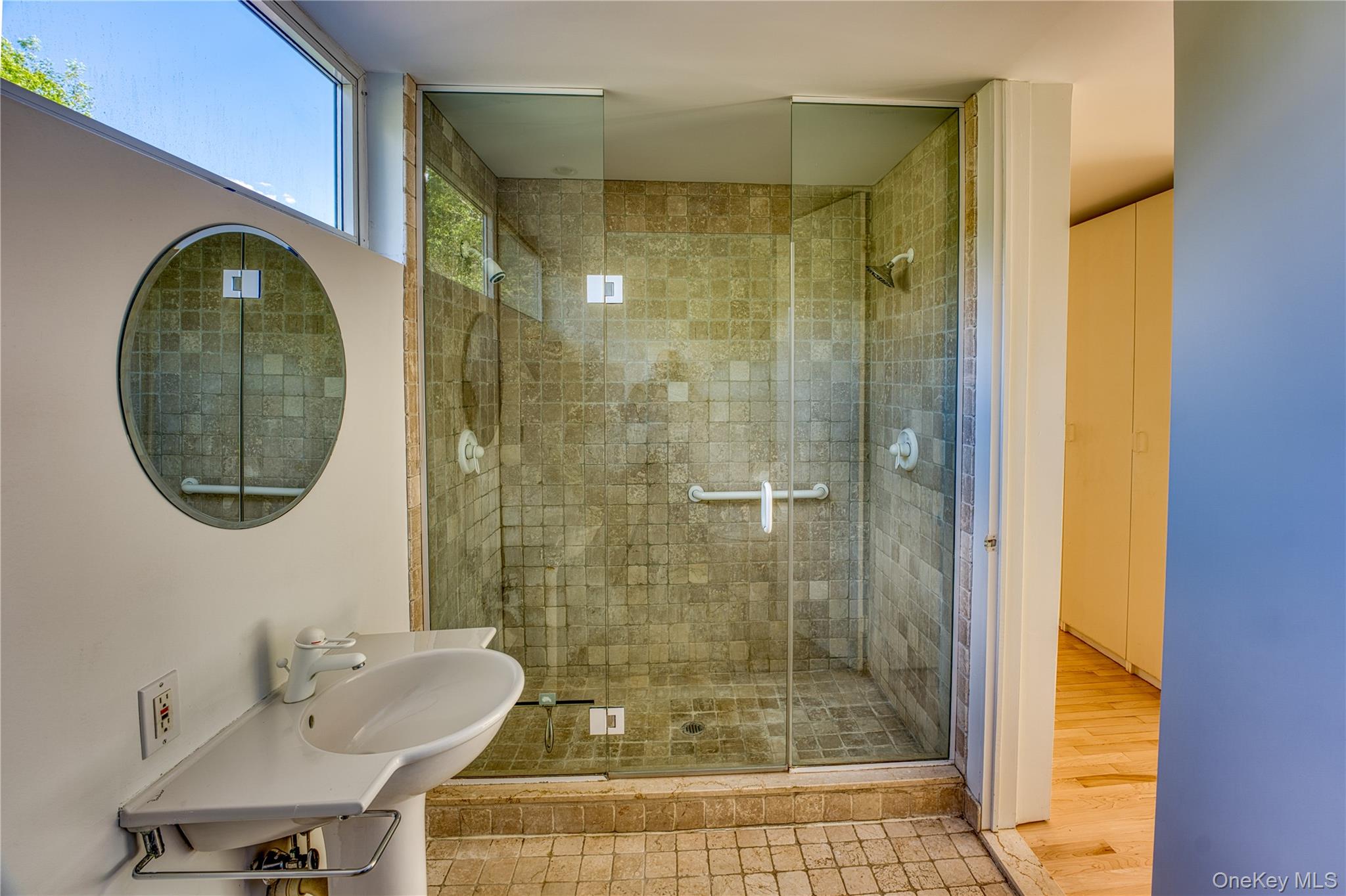 61 Indian Brook Road Garrison, NY 10524 - Photo 14 of 23 a bathroom with a sink a toilet and shower