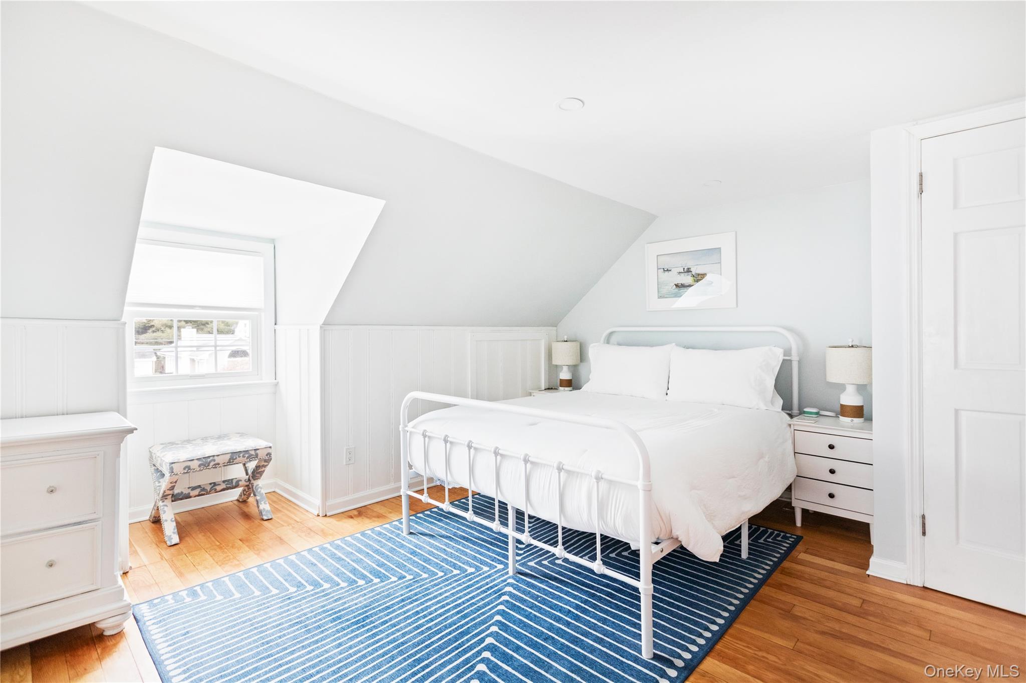 11 Bieselin Road Bellport, NY 11713 - Photo 12 of 17 a bedroom with a bed and wooden floor