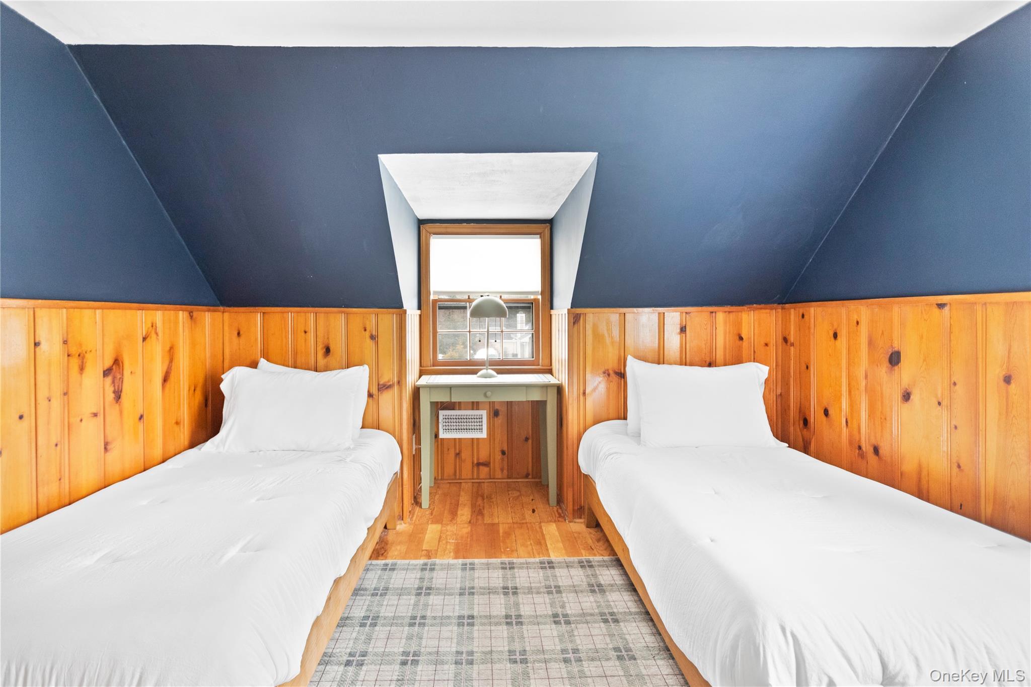 11 Bieselin Road Bellport, NY 11713 - Photo 13 of 17 a bed room with a bed and a night stand