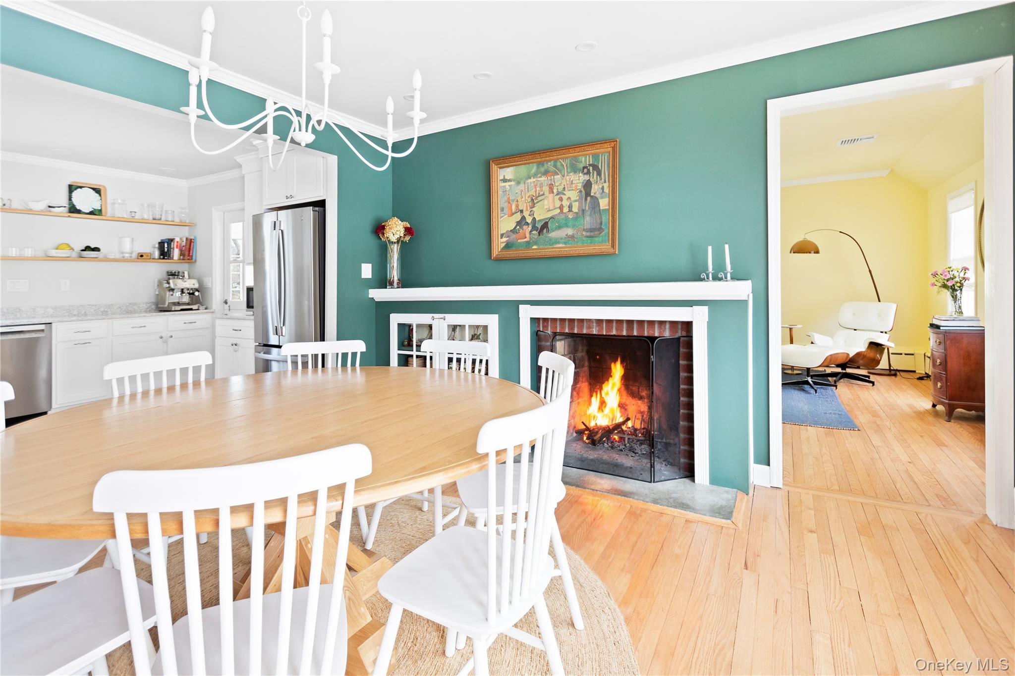11 Bieselin Road Bellport, NY 11713 - Photo 4 of 17 a view of a livingroom with furniture fire place and a chandelier