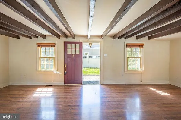 a view of entryway with wooden floor