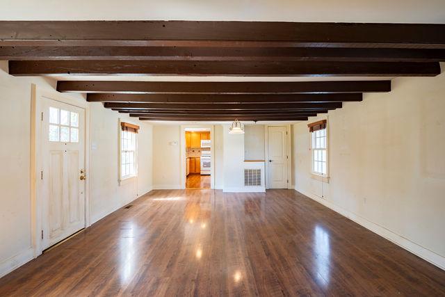 6 Letchworth Avenue Yardley, PA 19067 - Photo 6 of 23 a view of an empty room with wooden floor and a window