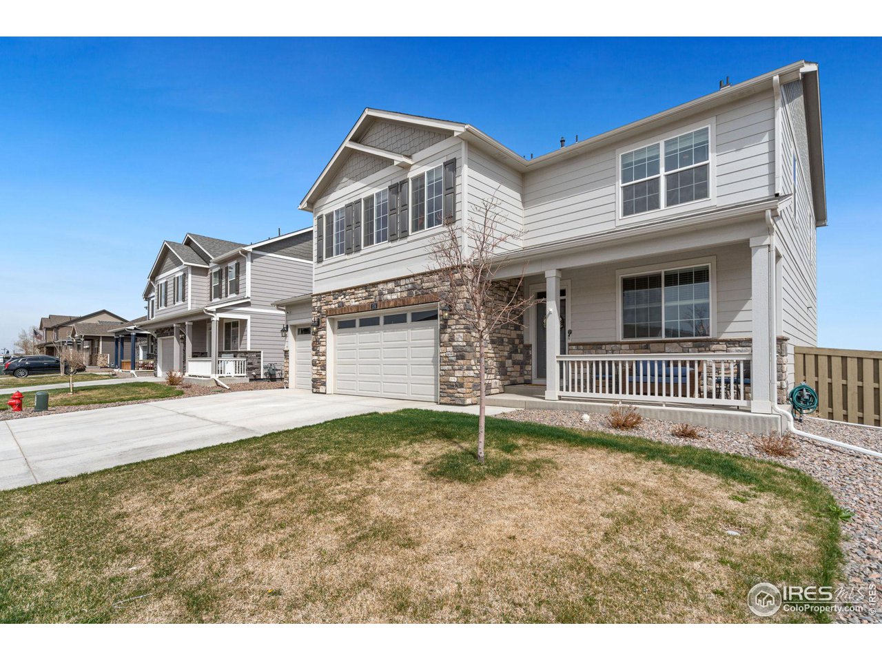 176 Haymaker Lane Severance, CO 80550 - Photo 2 of 25 a front view of a house with a yard