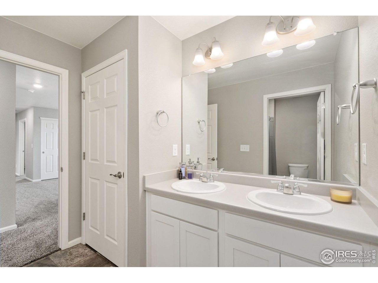 176 Haymaker Lane Severance, CO 80550 - Photo 22 of 25 a bathroom with a sink and a mirror