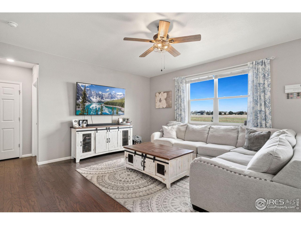 176 Haymaker Lane Severance, CO 80550 - Photo 6 of 25 a living room with furniture and kitchen view