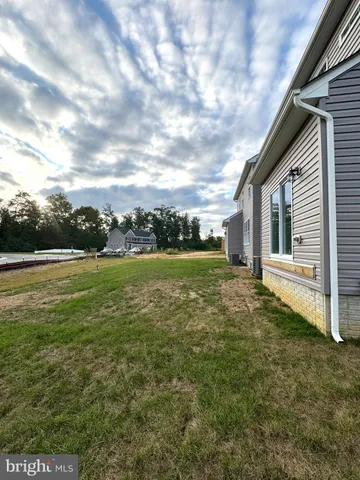 a view of outdoor space with deck and yard