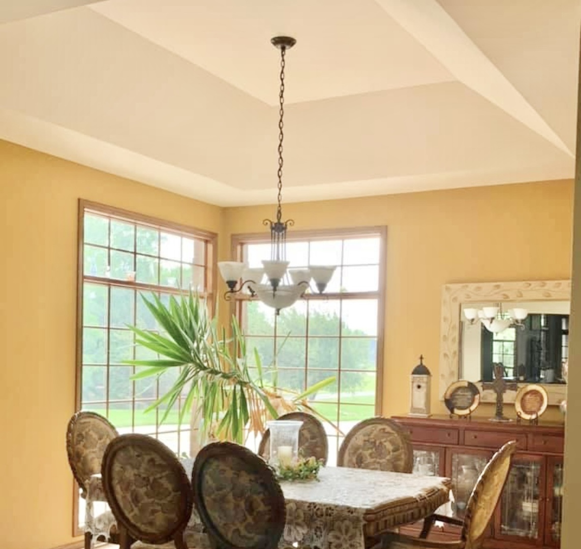 1709 North 2479th Road Ottawa, IL 61350 - Photo 6 of 9 a living room with furniture and a floor to ceiling window