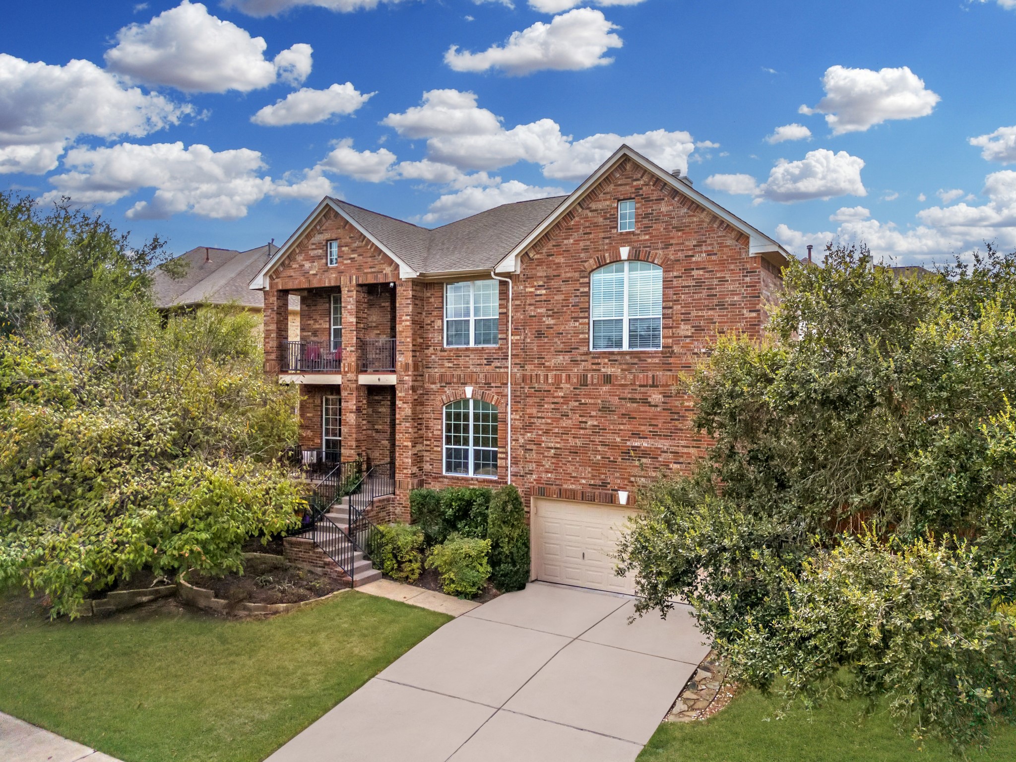 7109 Via Correto Drive Austin, TX 78749 - Photo 1 of 1 a front view of a house with garden