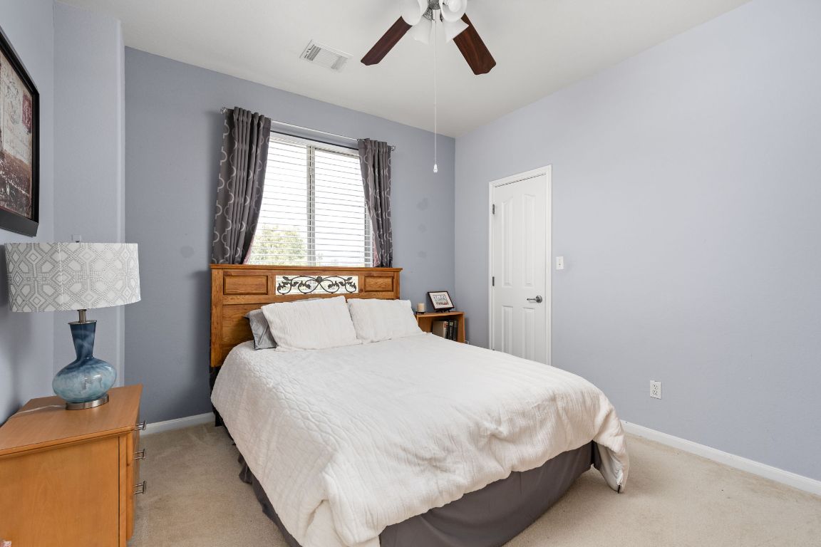 7109 Via Correto Drive Austin, TX 78749 - Photo 26 of 40 a bedroom with a bed and a window