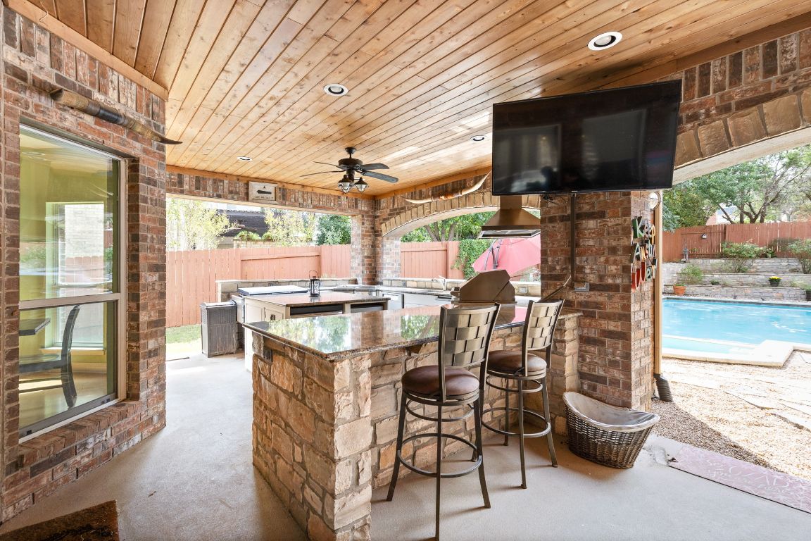 7109 Via Correto Drive Austin, TX 78749 - Photo 32 of 40 a view of a patio with a table and chairs