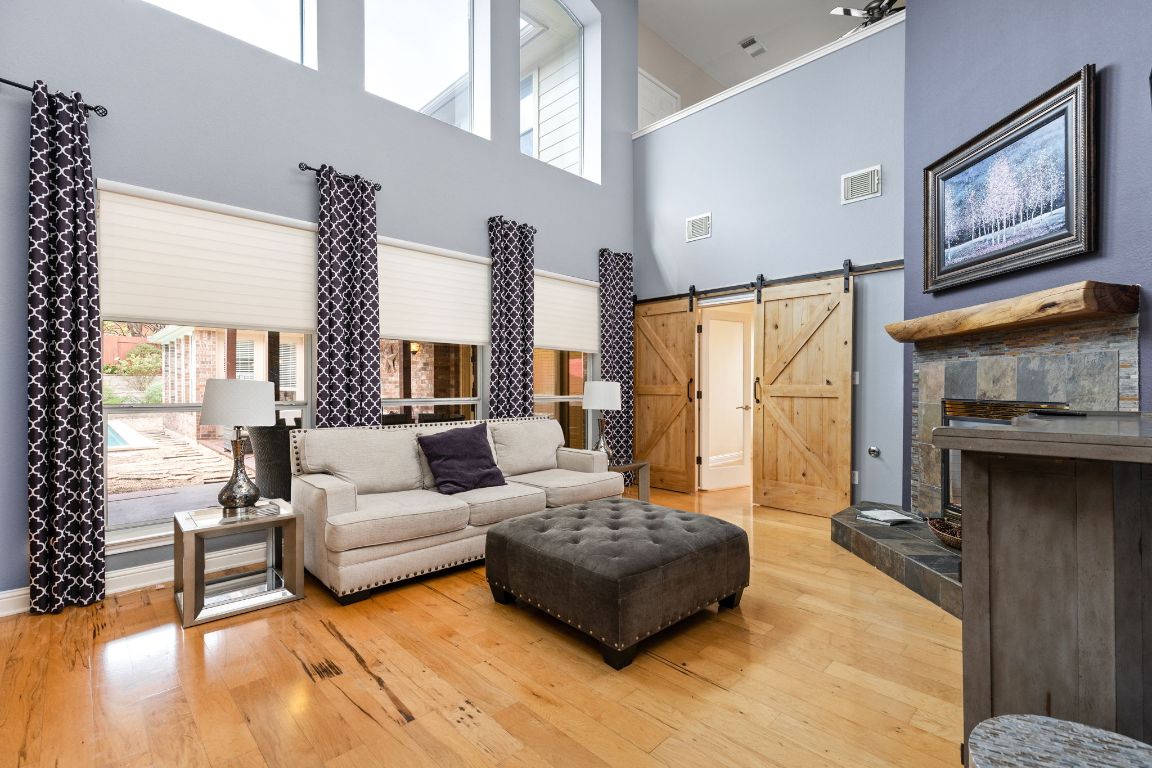 7109 Via Correto Drive Austin, TX 78749 - Photo 6 of 40 a living room with furniture large window and fireplace