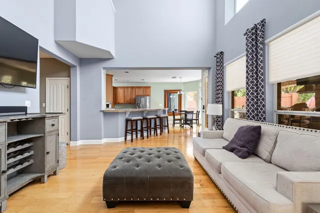 a kitchen with stainless steel appliances granite countertop a refrigerator a sink stove and microwave