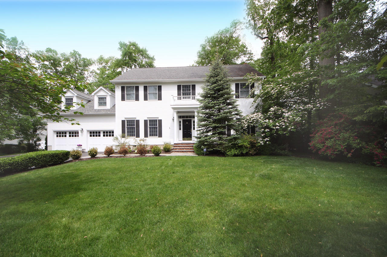 11 Revere Road Darien, CT 06820 - Photo 1 of 35 a front view of a house with a garden