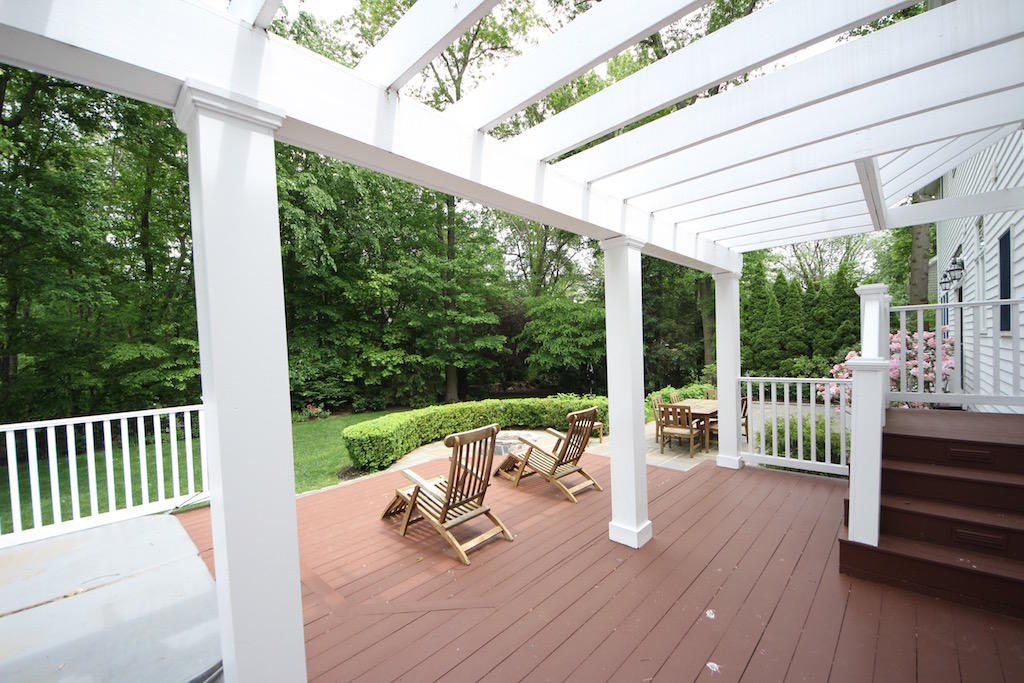 11 Revere Road Darien, CT 06820 - Photo 31 of 35 a view of a patio with a table chairs and wooden fence