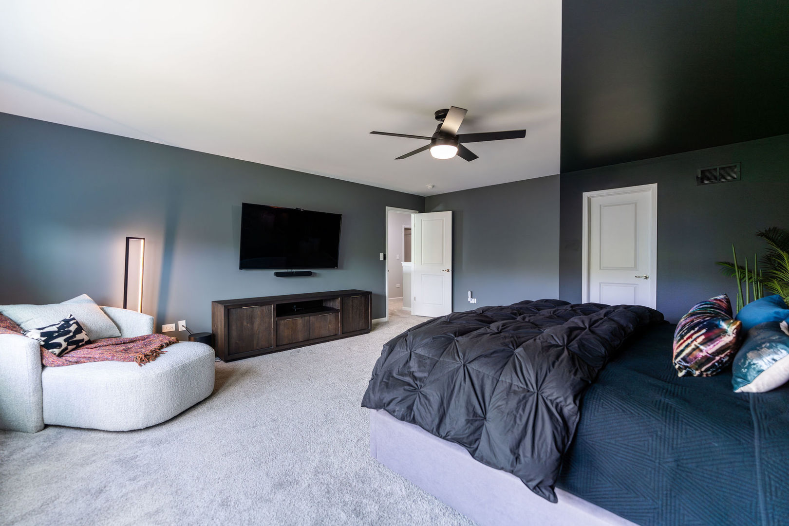 16230 Lake View Road Plainfield, IL 60586 - Photo 36 of 62 a bedroom with a bed and a flat screen tv