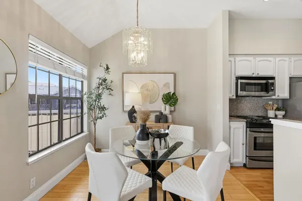 a dining room with furniture a livingroom and chandelier