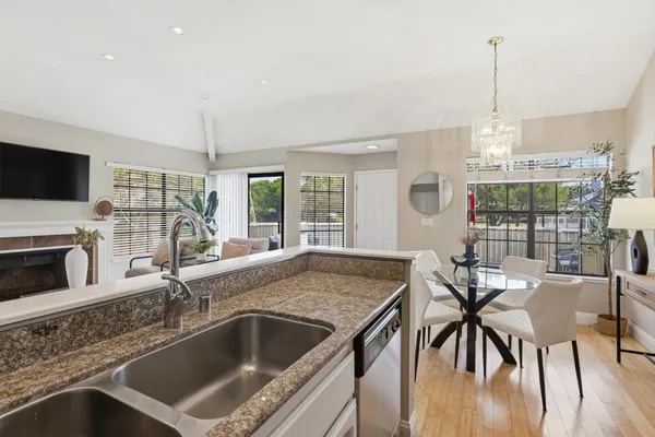 a kitchen with a stove a sink and a refrigerator