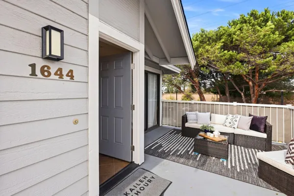 a view of balcony with furniture