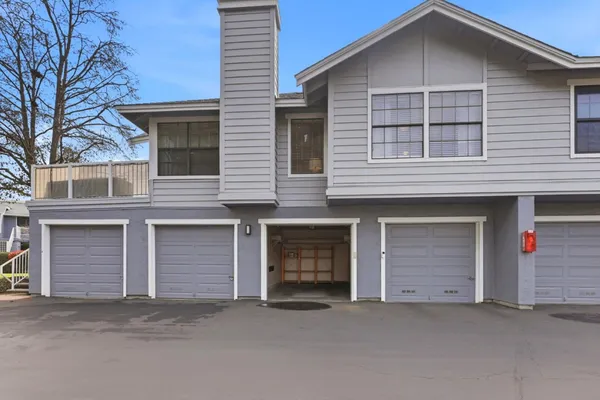 a front view of a house with garage