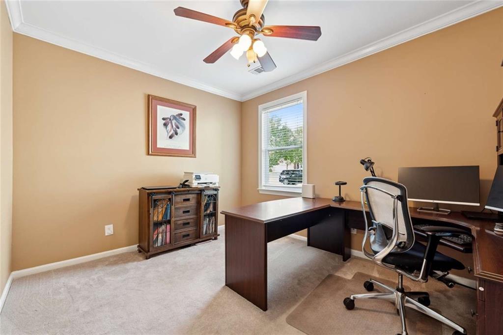 4510 Trailmaster Circle Cumming, GA 30028 - Photo 16 of 49 a view of a workspace with furniture and a window