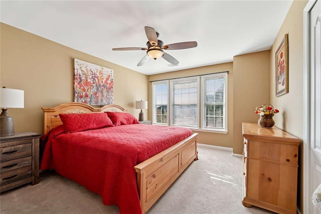 4510 Trailmaster Circle Cumming, GA 30028 - Photo 19 of 49 a bed room with a bed and a window