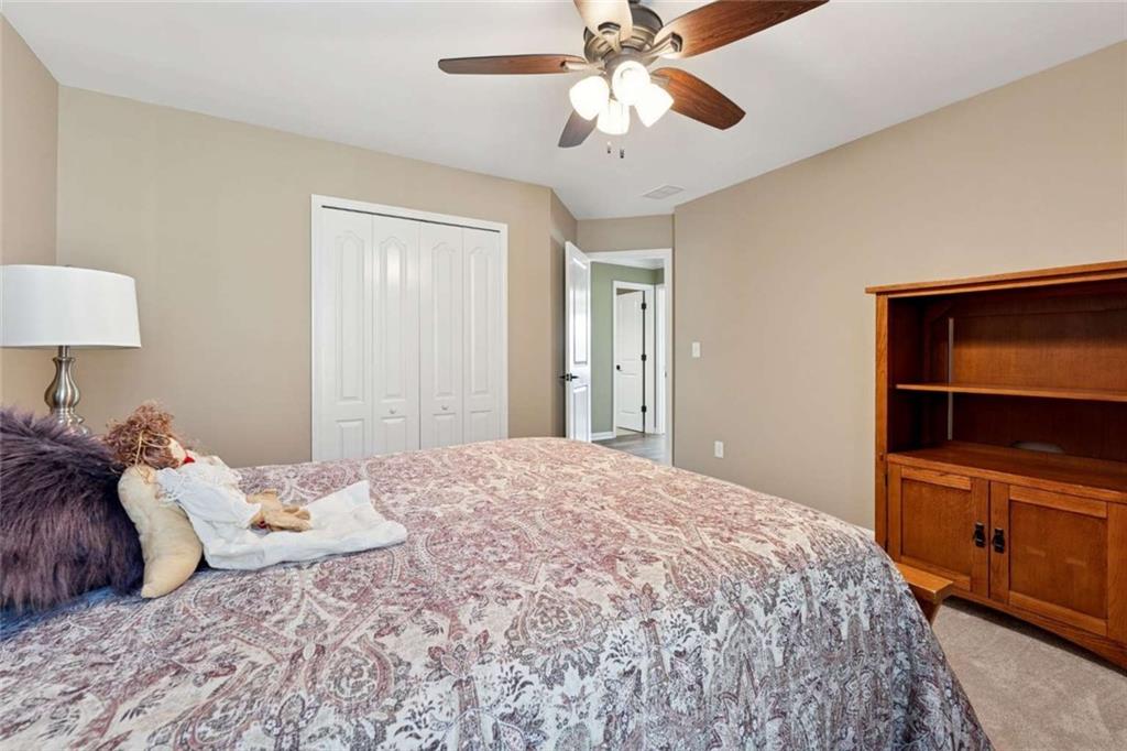 4510 Trailmaster Circle Cumming, GA 30028 - Photo 21 of 49 a bedroom with a bed and a view of bedroom