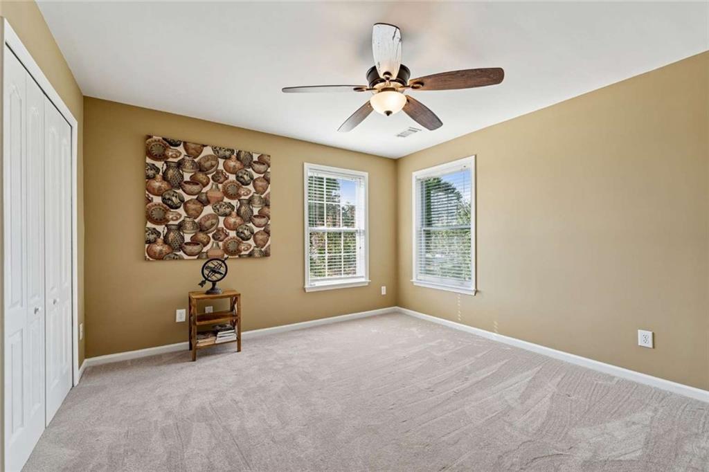 4510 Trailmaster Circle Cumming, GA 30028 - Photo 23 of 49 a view of an empty room with a window