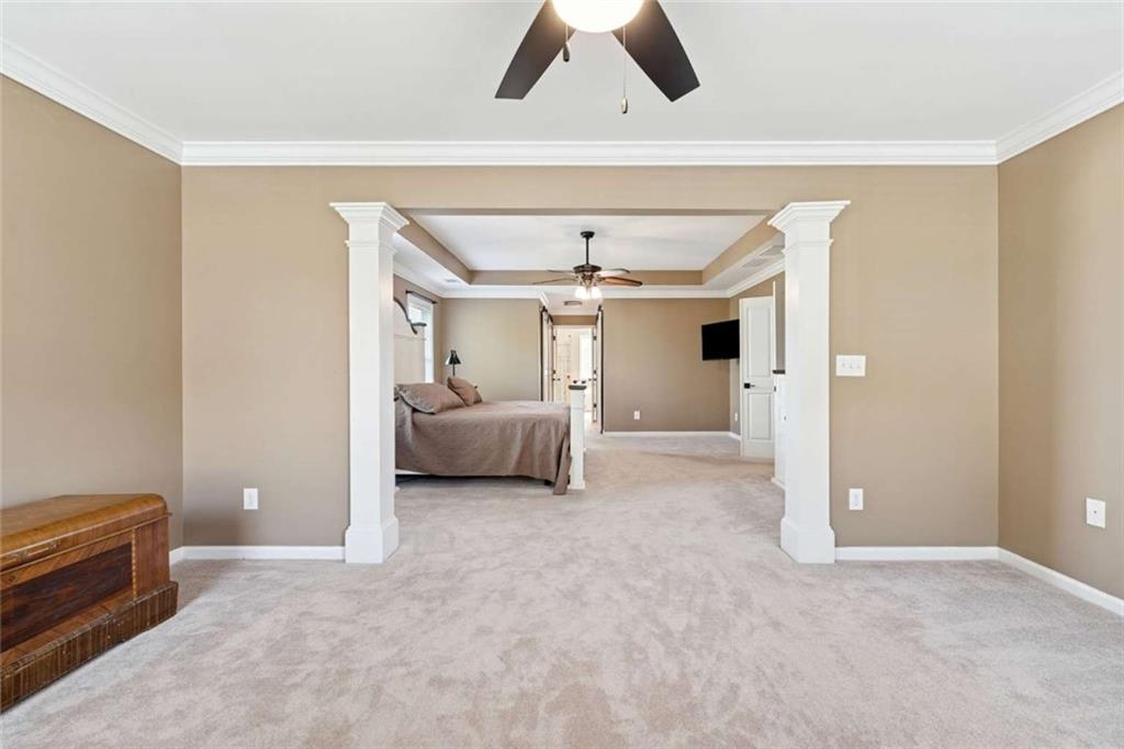 4510 Trailmaster Circle Cumming, GA 30028 - Photo 26 of 49 a view of a bedroom with closet and windows