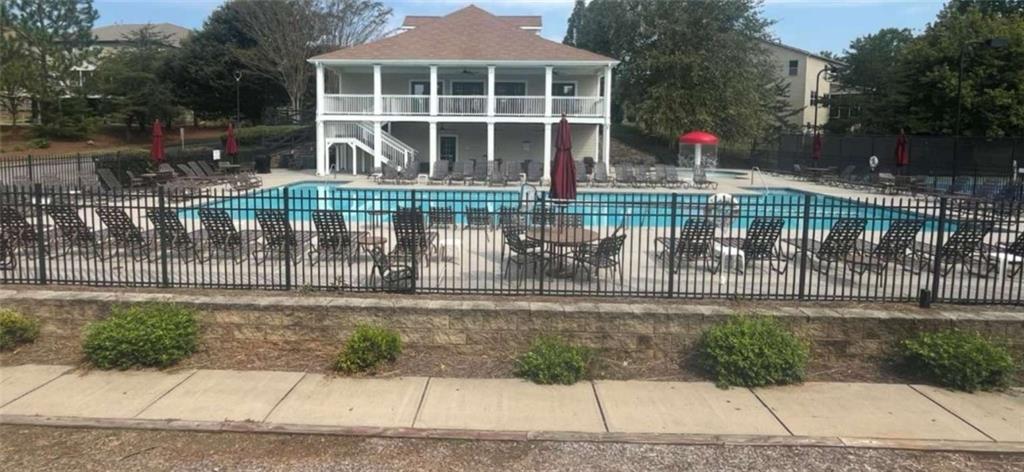 4510 Trailmaster Circle Cumming, GA 30028 - Photo 43 of 49 a front view of a house with a porch