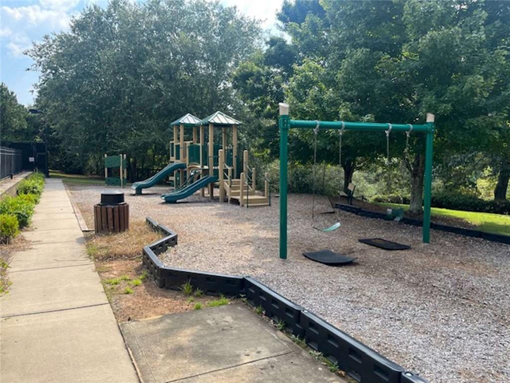 4510 Trailmaster Circle Cumming, GA 30028 - Photo 48 of 49 a view of a park with swings