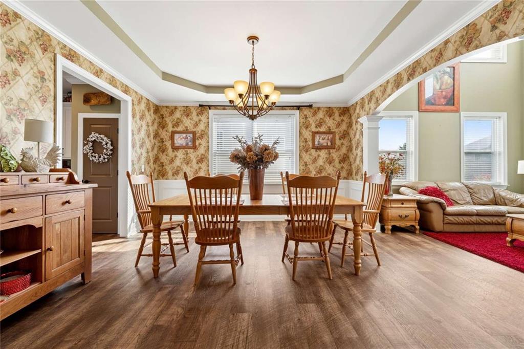 4510 Trailmaster Circle Cumming, GA 30028 - Photo 6 of 49 a view of a dining room with furniture window and wooden floor