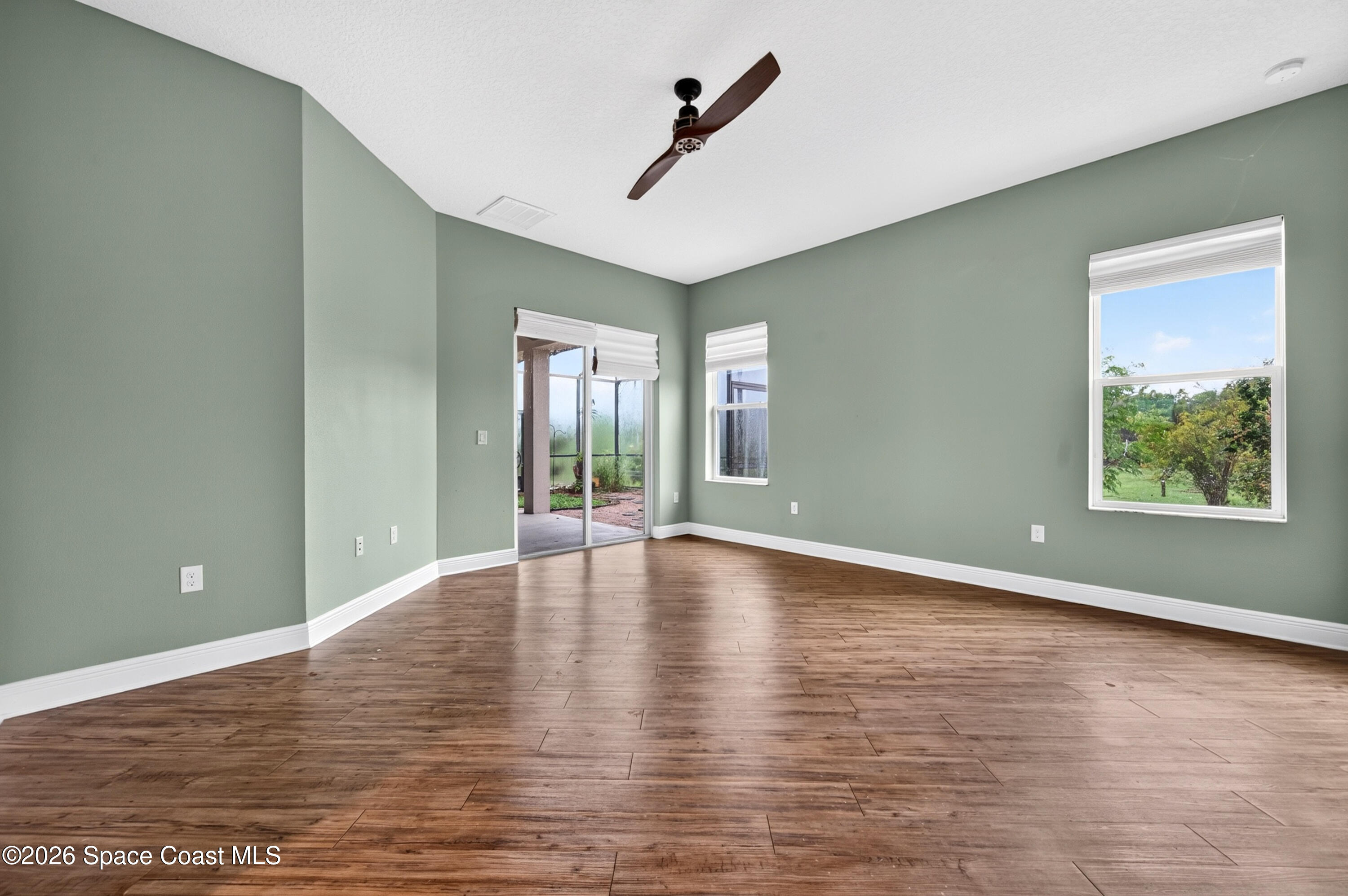 1475 Dalbora Road Merritt Island, FL 32953 - Photo 33 of 57 a view of empty room with wooden floor and fan