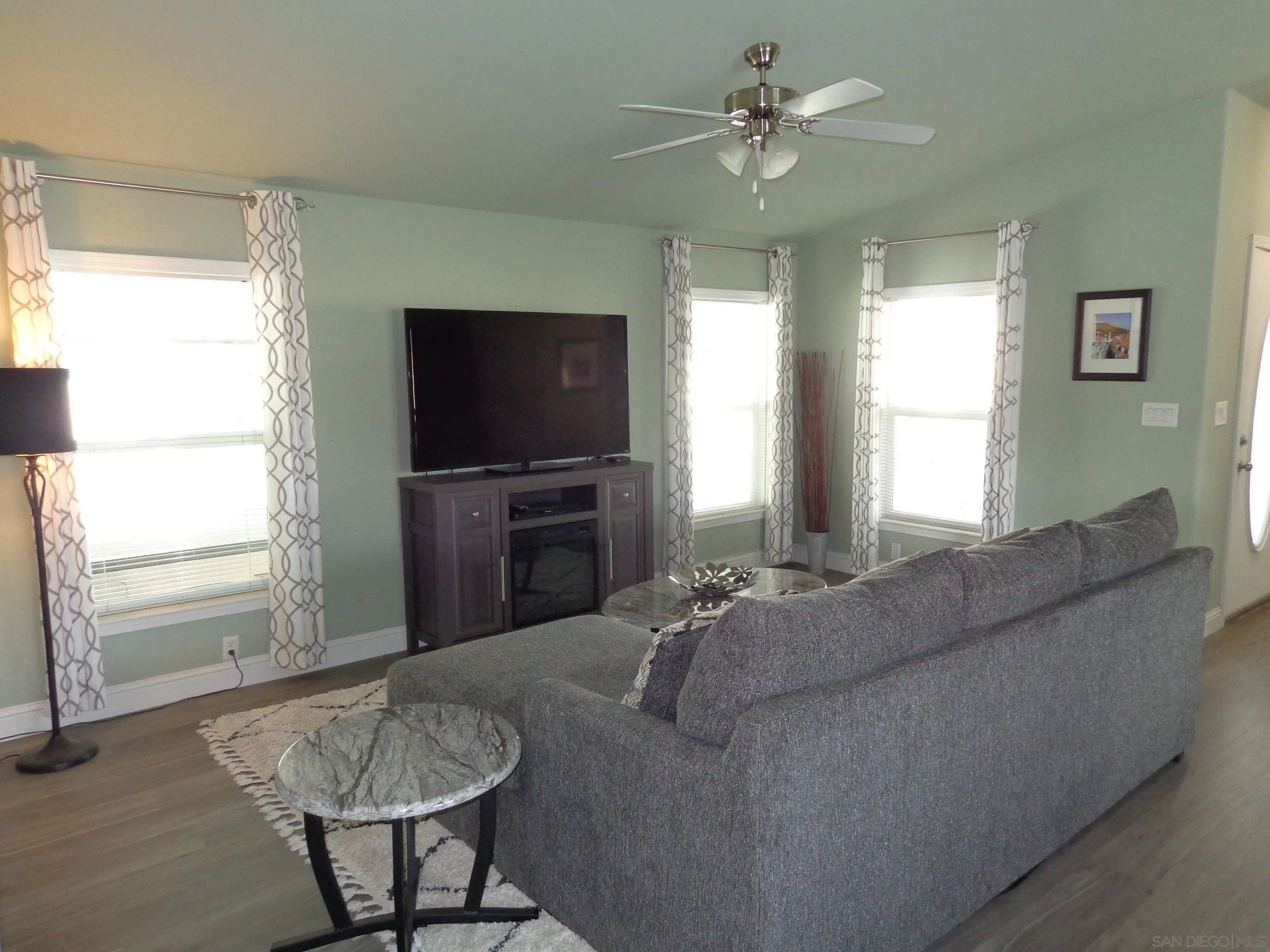 43 Havenview Lane Oceanside, CA 92056 - Photo 11 of 24 a living room with furniture and a flat screen tv